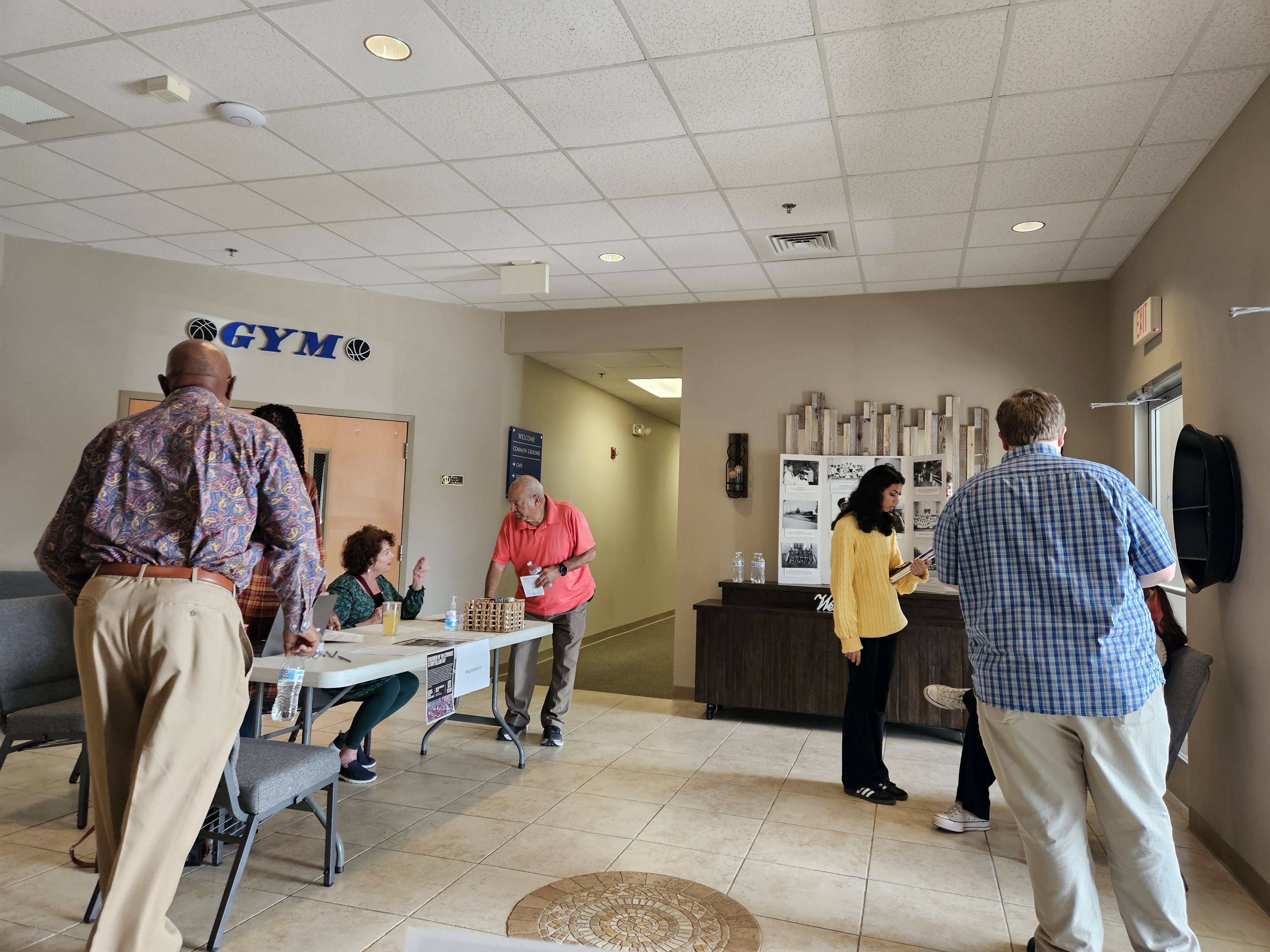 Photograph of interview participants and checking in and walking through lobby of New Day Christian Church.